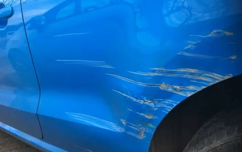 Vehicle scratch repair close-up